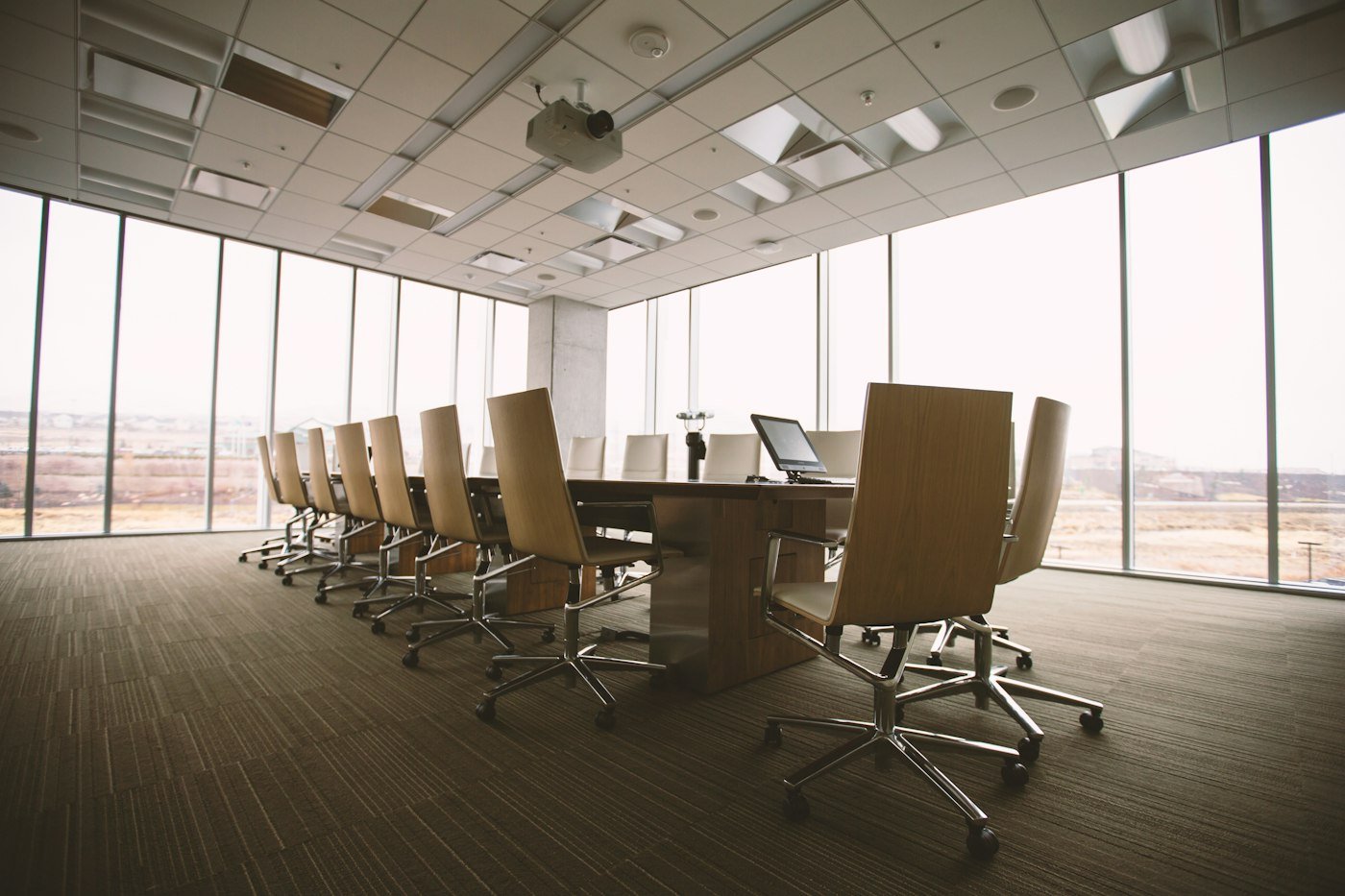 Corporate meeting room with a long conference table