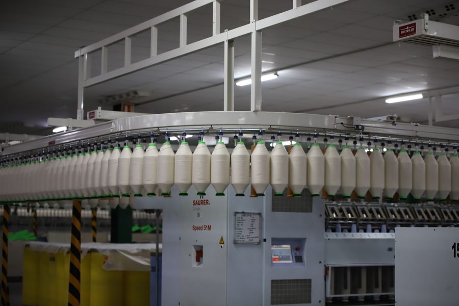 Knitting and processing unit using textile job order and yarn return tracking software